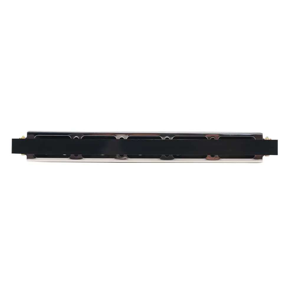Black rectangular electronic component with metallic edges and circuitry on the back of axiom 24 hole harmonica key of c