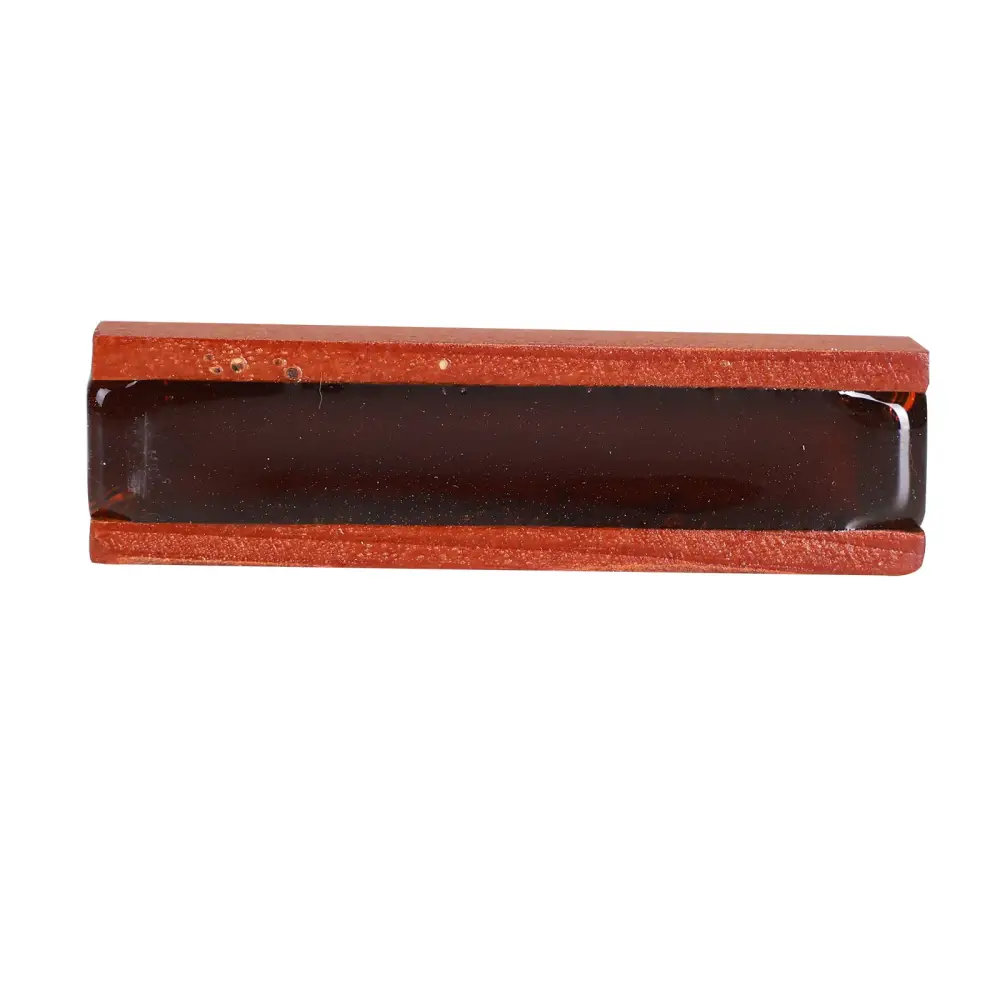 Red leather-bound rectangular box with dark glossy interior for axiom violin rosin storage and protection