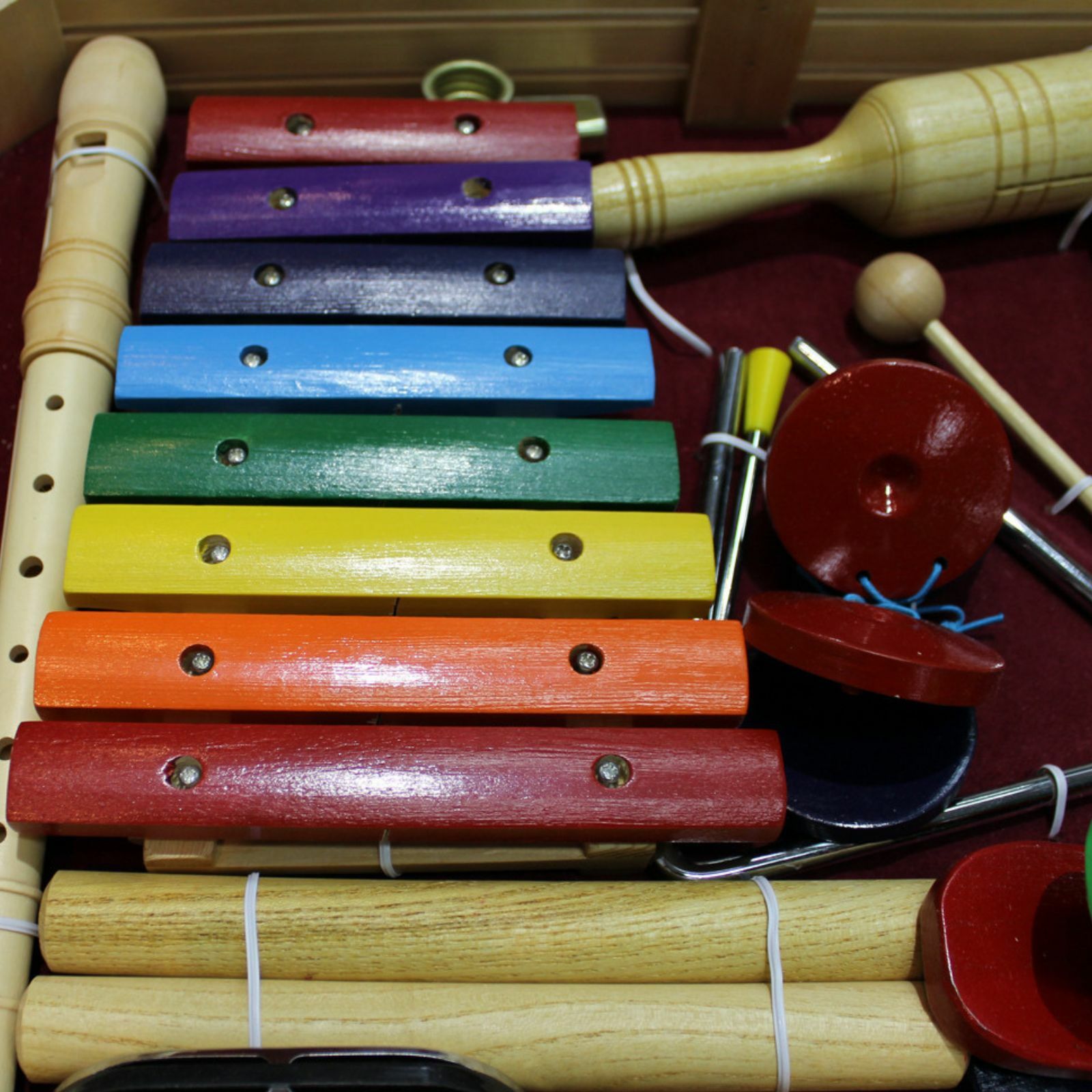 The Axiom Music Childrens Jumbo Sized Music & Percussion Pack comes in a wooden tray and includes a xylophone, maracas, guiro, jingle bells, triangle, and mallets.