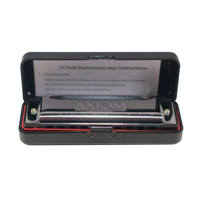 A sleek silver axiom 10 hole diatonic blues harp in c nestled in a black case with red lining
