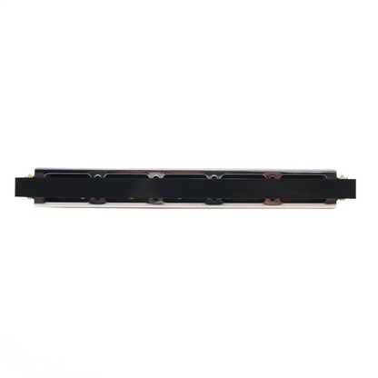Black rectangular electronic component with metallic edges and circuitry on the back of axiom 24 hole harmonica key of c