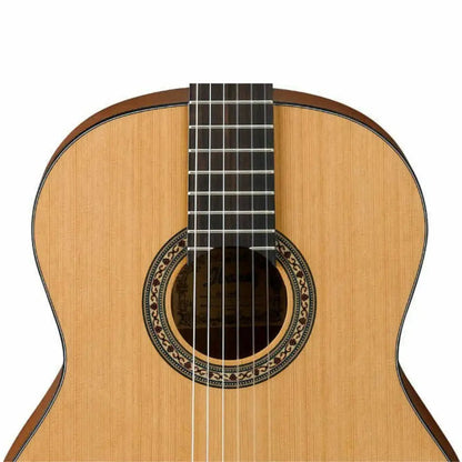 Light-colored wooden classical guitar from Axiom Beginners Guitar Pack with decorative rosette