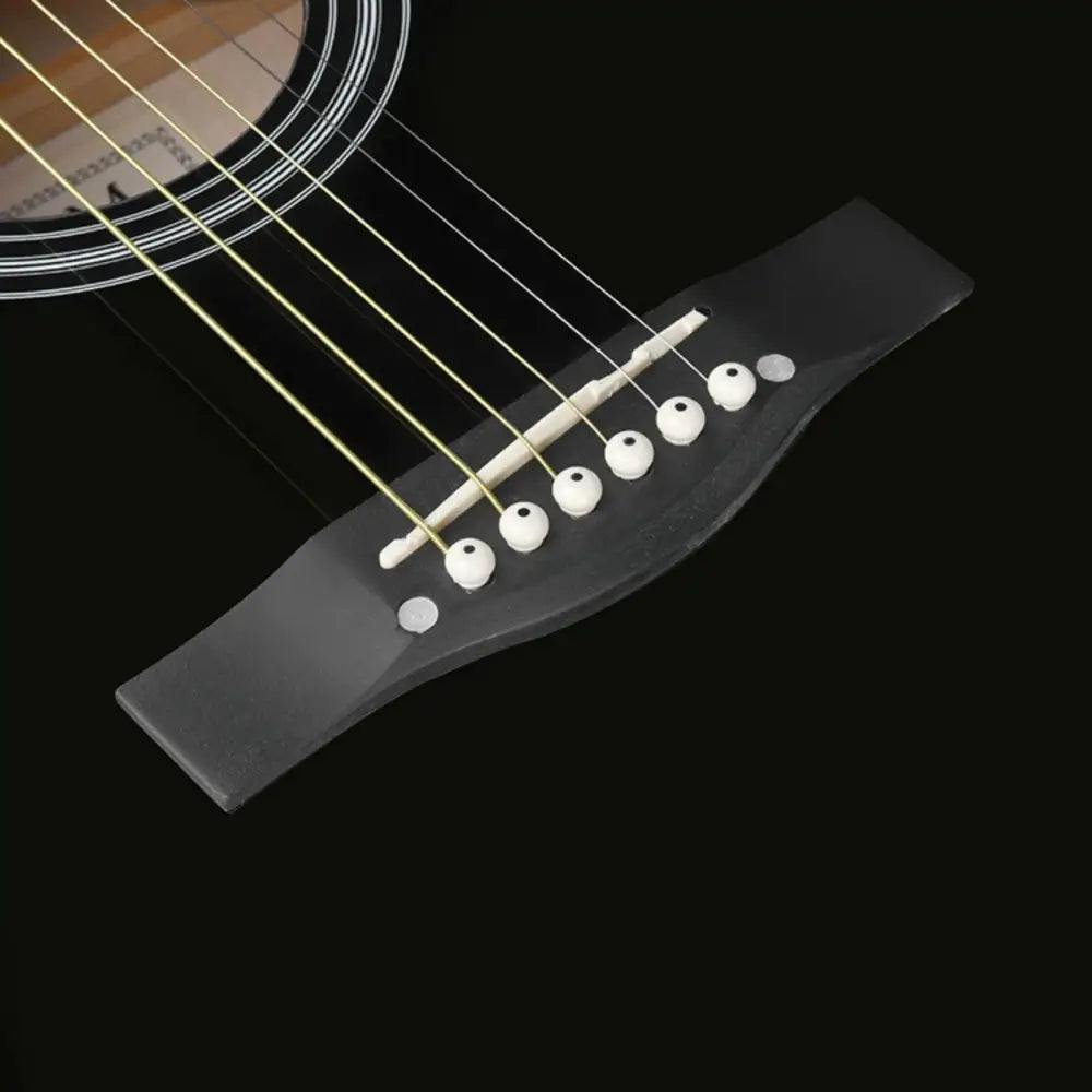 Black steel string guitar bridge with white pins on Axiom Folkmaster dreadnought guitar for sale