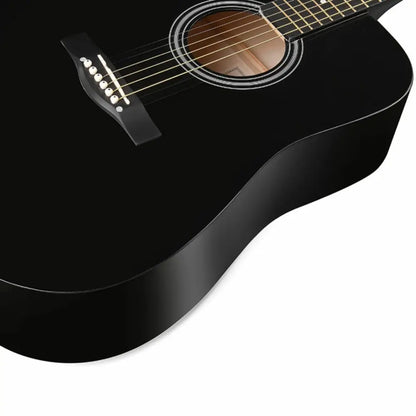 Black left handed guitar with six strings and natural wood inside soundhole for beginners