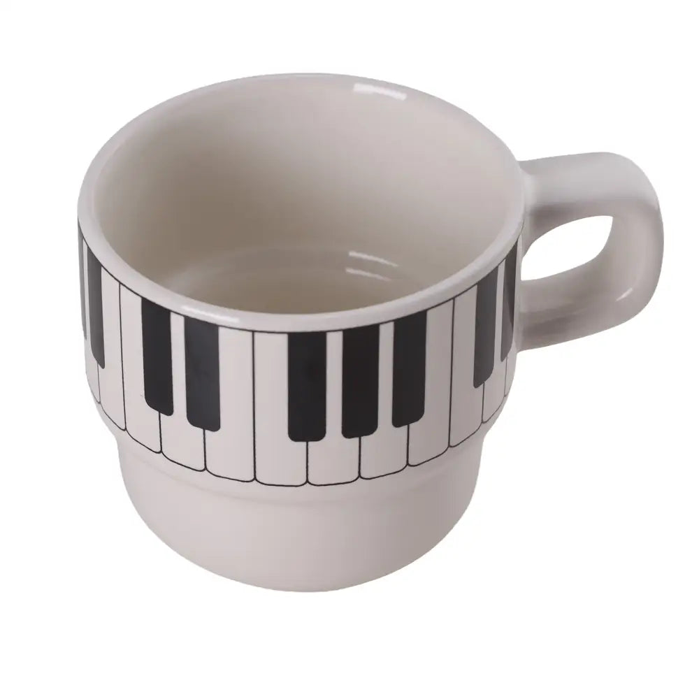 White ceramic coffee mug with black and white piano keyboard design perfect as a piano keyboard coffee gift