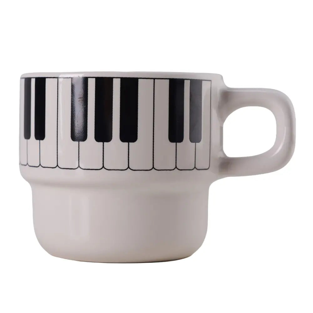 White ceramic coffee mug with black and white piano keyboard design perfect for piano keyboard coffee lovers