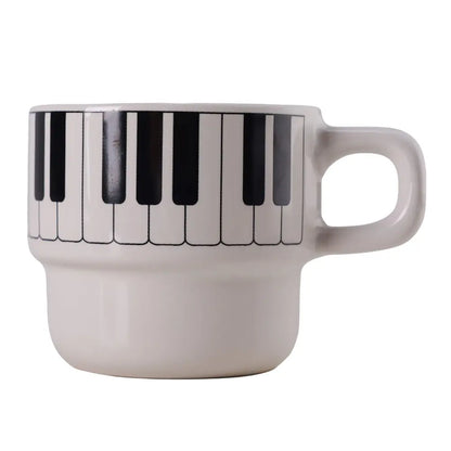 White ceramic coffee mug with black and white piano keyboard design perfect for piano keyboard coffee lovers