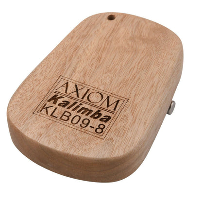 The Axiom Kalimba Thumb Piano by Axiom Music is crafted from camphor wood with an engraved floral design, labeled metal tines for notes and numbers, and comes with a tuning hammer for easy adjustments.