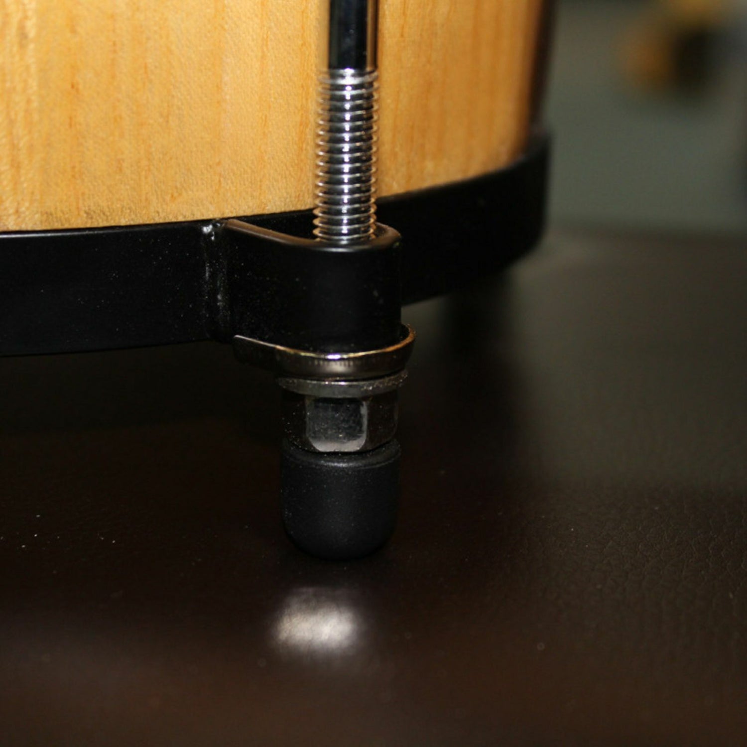 The Axiom Bongo Drum Set - Natural Finish by Axiom Music features connected toon wood shells with natural calf skin heads and metal tuning hardware.