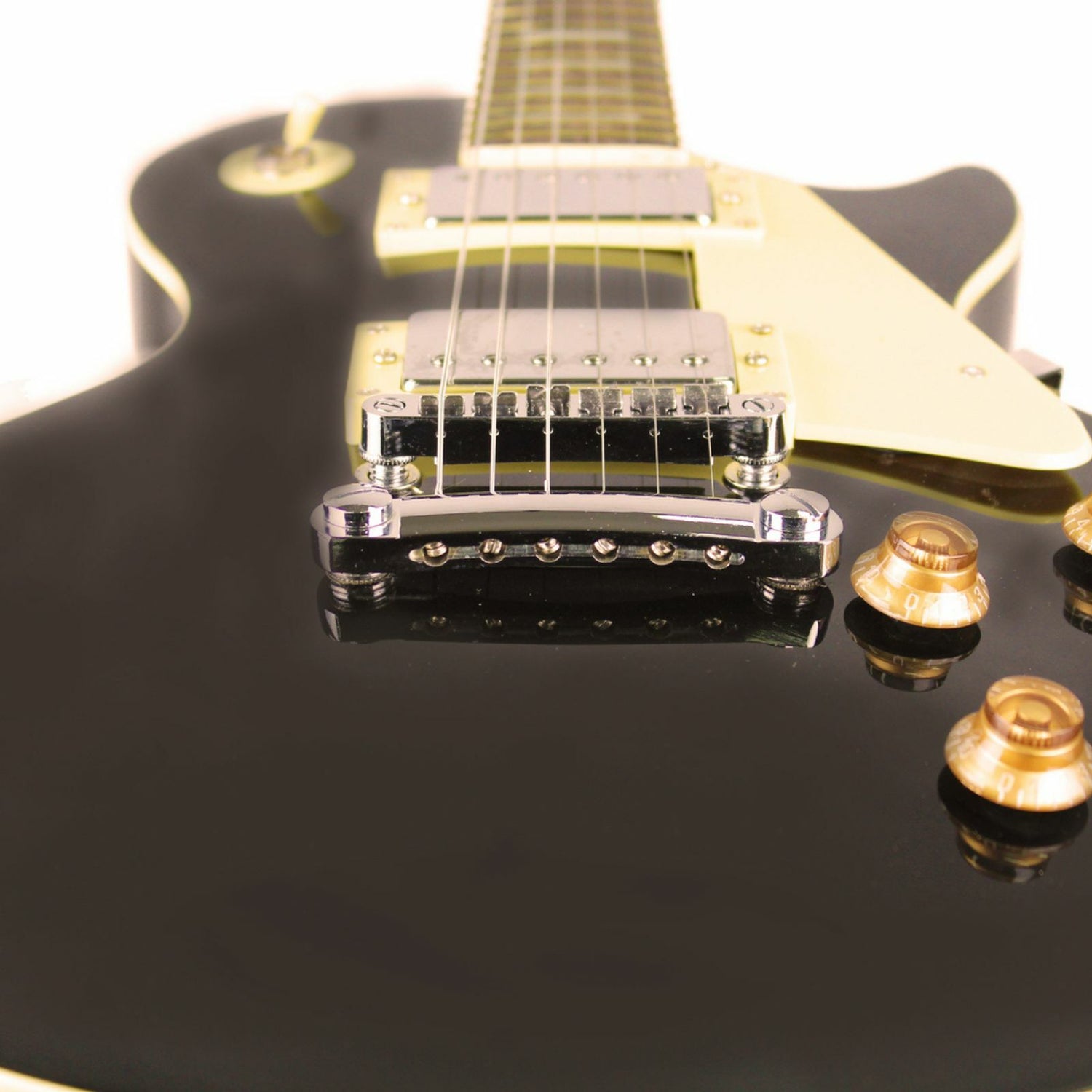 An Axiom Music Challenger Electric Guitar - Black features a single cutaway, vintage humbuckers, white pickguard, and four control knobs, photographed on a plain white background.