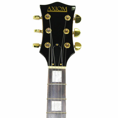 The Axiom Music Axiom Columbia Archtop Electric Guitar in Sunburst features gold hardware, vintage-style humbuckers, four control knobs, and a left-side f-hole.