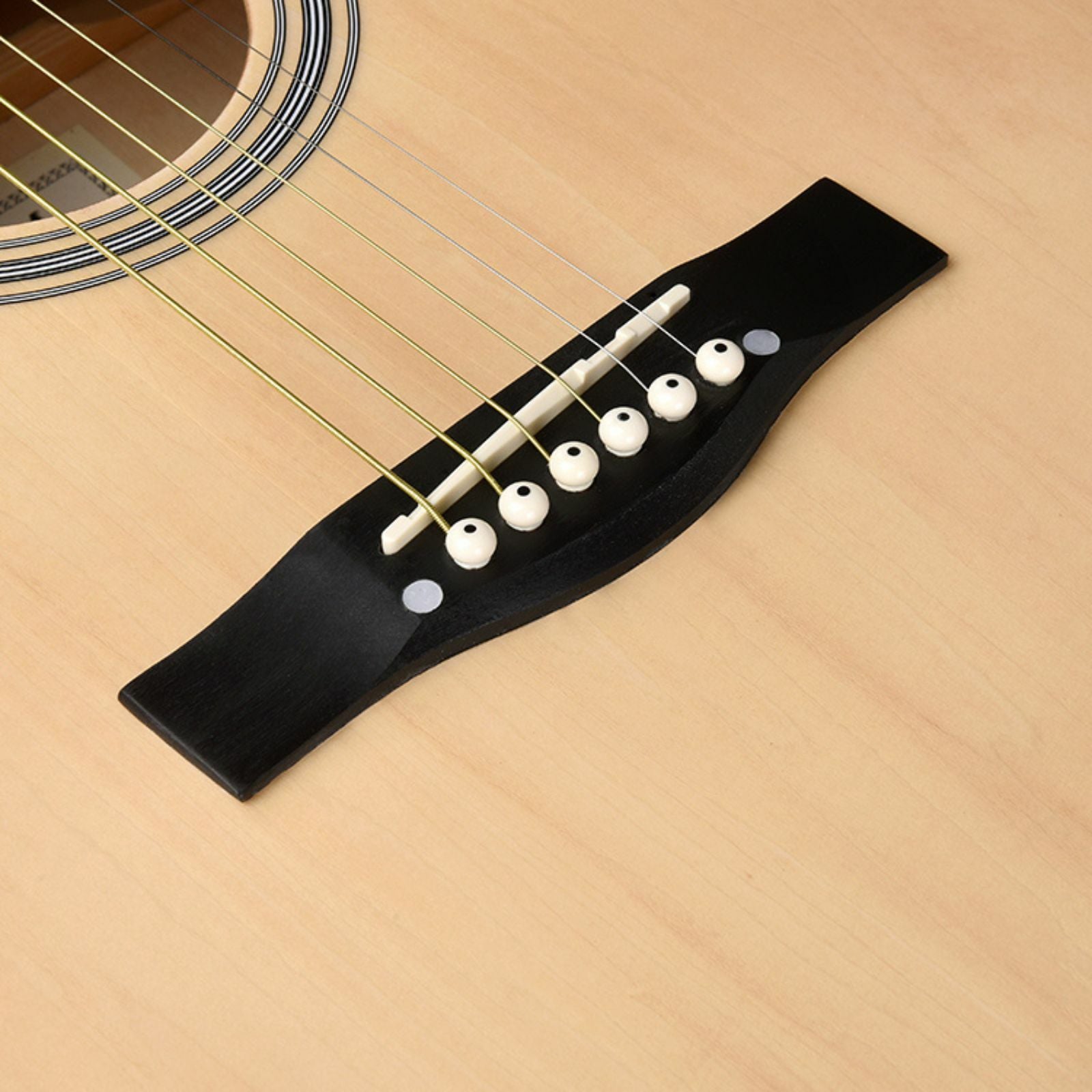 The Axiom Folkmaster Full Size Steel String Guitar by Axiom Music features a light wood top, dark sides, six steel strings, and metal tuning pegs for a rich tone. Crafted from quality timbers, it stands upright against a white background.