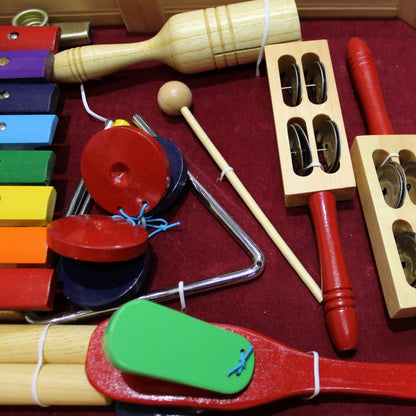 The Axiom Music Childrens Jumbo Sized Music &amp; Percussion Pack comes in a wooden tray and includes a xylophone, maracas, guiro, jingle bells, triangle, and mallets.