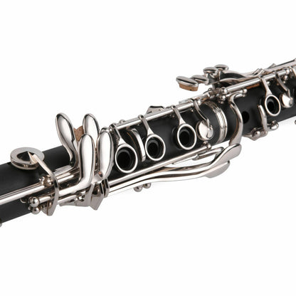 The Axiom Music Prelude Clarinet Outfit, a school band clarinet in black with silver keys and crafted from composite material, is displayed angled on a white background with its bell facing forward.