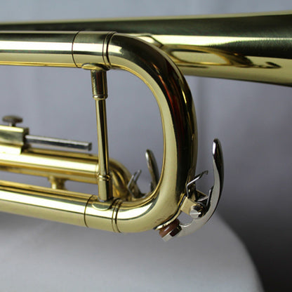 The Axiom Prelude Trumpet Outfit - School Band by Axiom Music includes a yellow brass body, three valves, and a silver mouthpiece, shown on a white background for easy playability.